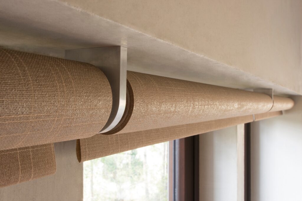 Motorized shades and climate control system in a modern home, featuring automated blinds for energy efficiency and smart home integration